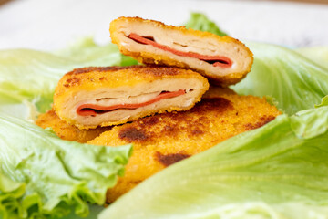 cordon bleu chicken nuggets with salami in close-up