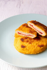 cordon bleu chicken nuggets with salami in close-up