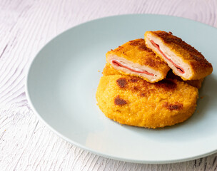 cordon bleu chicken nuggets with salami in close-up