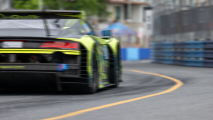 Motion blur race car racing on speed track, Motion blurred super car race on street track circuit,...