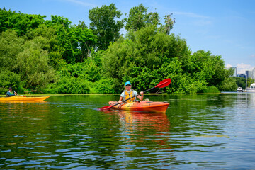 Healthy active outdoor lifestyle: sea kayaking on the Toronto Islands on a sunny July afternoon...