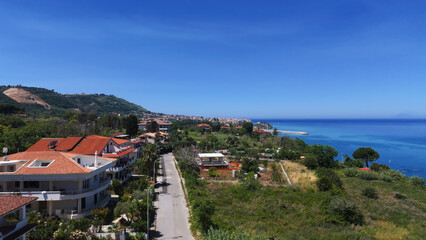 Vast Mediterranean Sea view with houses, vegetation and mountains in Calabria, Southern Italy