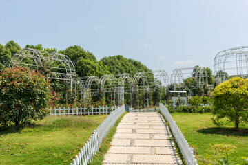 The green lawn and flagstone paths in the park