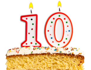  - Number 10 Festive Candle with Polka Dots and Flame, Sitting on Frosted Cake Slice, Isolated PNG