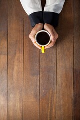 Cropped woman holding coffee cup © vectorfusionart