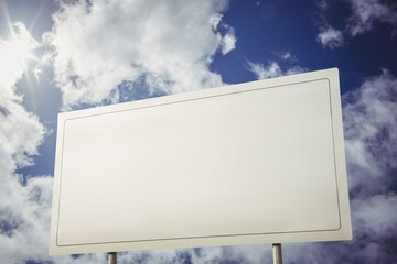 White billboard against cloudy sky