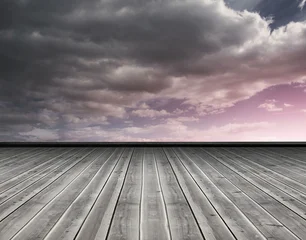 Schilderijen op glas Wooden planks against purple sky © vectorfusionart