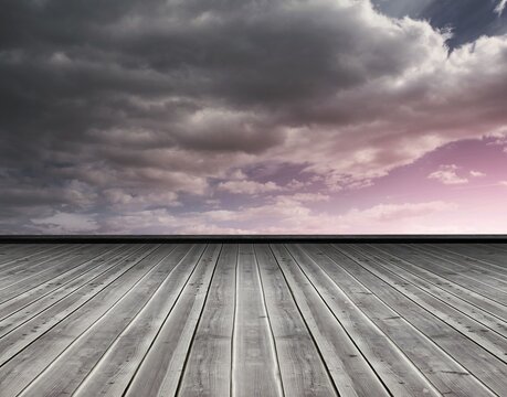 Fototapeta Wooden planks against purple sky