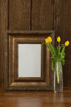 Photo frame and camera on table