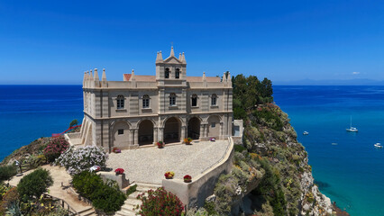 Aerial view of Santa Maria dell'Isola sanctuary on a cliff overlooking Tropea beach, Calabria,...