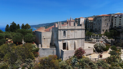 Aerial view of Santa Maria dell'Isola sanctuary on a rocky islet and the old town of Tropea with...