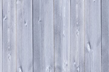 Showing close-up vertical wooden fence panel in flat design, highlighting knots, seams, weathering