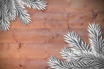 Fir branches over wooden planks