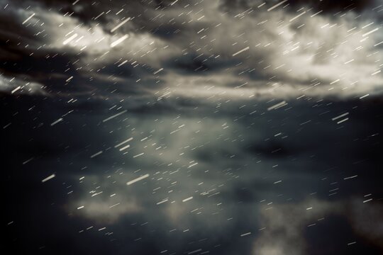 Fototapeta Cloudy sky with snow falling