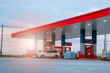 Gasoline pump nozzle sign. Fuel pump petrol station,Oil and Gas station at sunrise and orange sky .