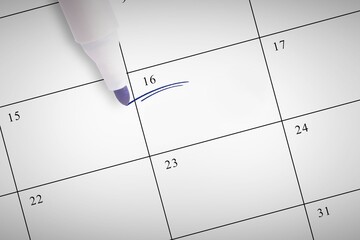 High angle view of felt tip pen on calendar