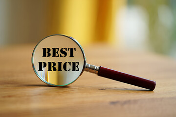 Magnifying glass revealing best price text on wooden surface image
