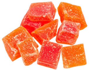 Close up of dried papaya cubes falling against a transparent background, creating a vibrant and appetizing image