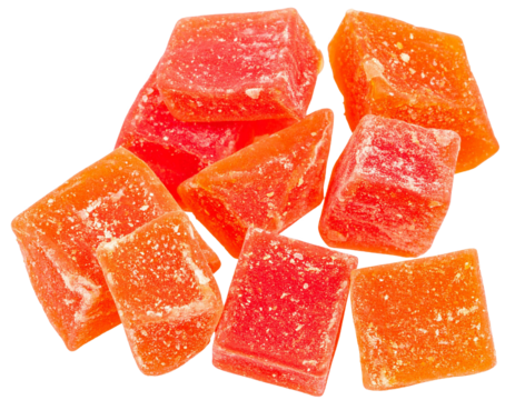 Close up of dried papaya cubes falling against a transparent background, creating a vibrant and appetizing image