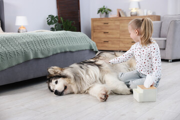 Girl suffering from allergy with her dog at home