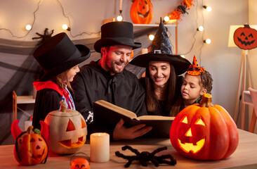 Family with kids reading book together in costumes, celebrating halloween during a lively party at home, creating festive joy with shared holiday fun and excitement under a warm, spirited gathering.