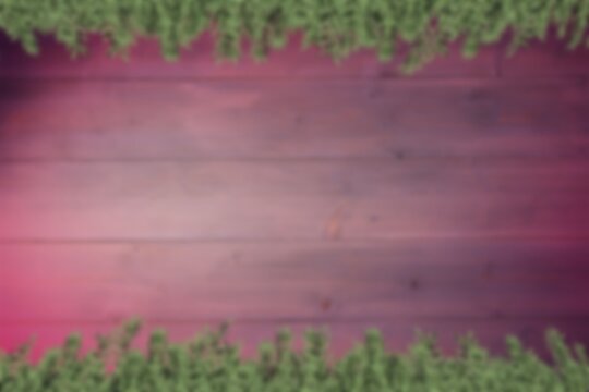Fototapeta Blurred fir tree branches on wood