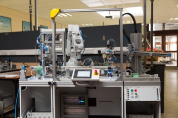 Showing flat design 6-axis robot arm in lab featuring safety frame touchscreen console and sensors