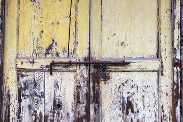 Old wooden doors and metal door bolts