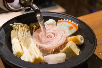 Traditional hot pot dinner with boiling soup
