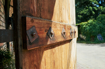 Wooden door has a metal bracket holding it up
