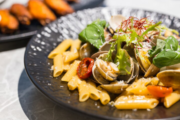 Clam pasta served on ceramic plate