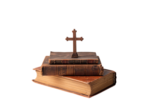 Stack of old books with a cross on top on a black background, transparent background