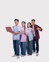 Obraz premium Group of friends giving thumbs up smiling with one holding a laptop Studio shot on white
