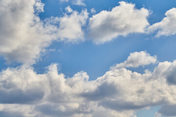 The depth of the sky and the texture of the clouds create an immersive atmospheric effect. A symbol...