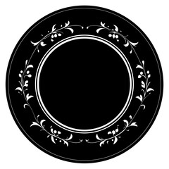 A black circular plate with an ornate white floral vine pattern around the rim