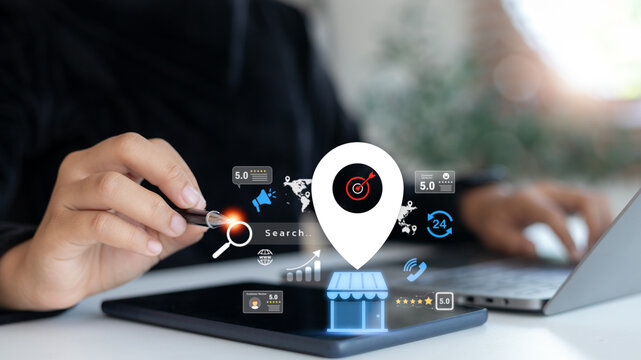 Hand using digital tablet with virtual icons of local search, business rating, customer review and online marketing, representing local SEO and digital visibility.