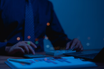 Blue lit Night Accounting Scene Strategic Financial Management, KPI Analysis, And Leadership Insights With Graph Data For Potential IPOs, Focusing On Value Creation