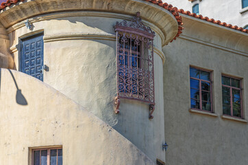 Islamic Architecture on an Old White Building with Facade and Red Tile Roof.