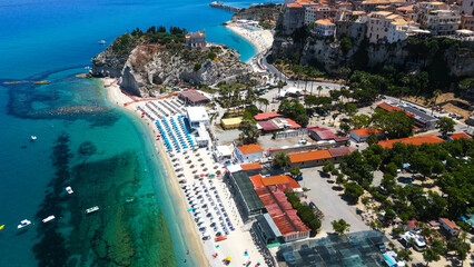 Aerial view of the picturesque coastal town of Tropea, Italy, highlighting the vibrant beach...