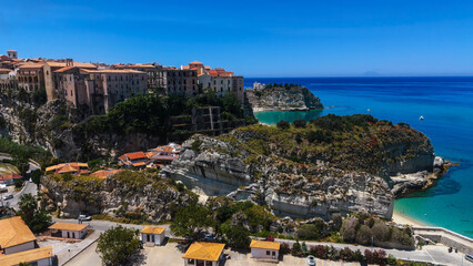 Aerial view of Tropea, a charming town perched on a cliff overlooking the crystal clear waters of...