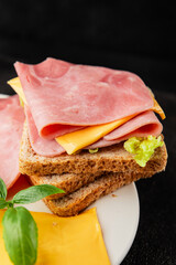 Sandwich ham, cheese, bread toast meat spam fresh delicious gourmet food background on the table rustic food top view copy space
