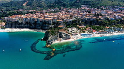 Aerial view of Tropea, Calabria, Southern Italy, with turquoise sea, sandy beach and houses...