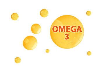 Yellow drops of Omega-3 on white background