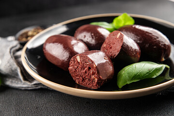 Black pudding sausage fresh delicious gourmet food background on the table rustic food top view...