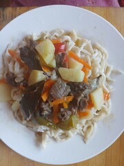 Homemade Lagman noodles with vegetables and meat