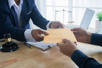 Lawyer at desk in office with legal documents and hammer, giving advice on justice, contracts,...