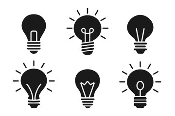 Light bulb icon collection. Set of flat lightbulb silhouettes with rays for idea, inspiration, and creativity concepts © stas111