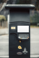 Modern street parking payment terminal with blank white screen for mockup, featuring solar panel on top, tactile keypad, contactless payment option, and ticket dispenser in urban environment