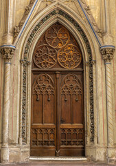 Obraz premium Gothic wooden doors. Medieval architectural decor. Ornate portal patterns