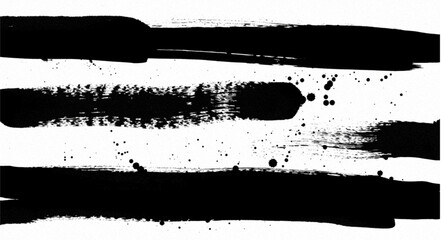 Black ink brush strokes and splatters creating an abstract artistic background design on white paper surface